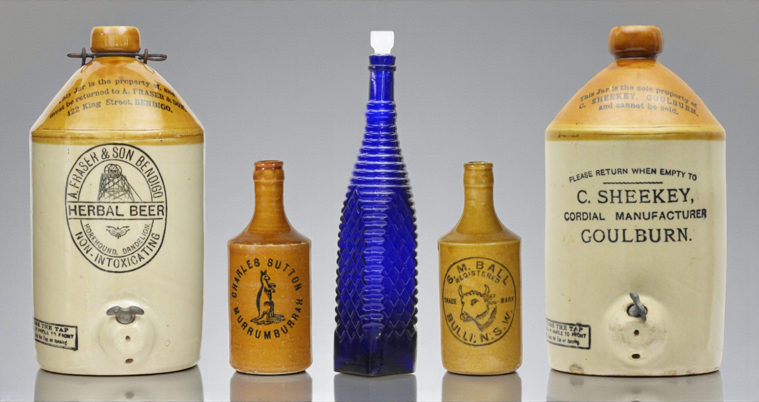 a fraser and son bendigo demijohn, charles sutton murrumburrah crown seal ginger beer, S.M. ball bulli crown seal ginger beer, c. sheekey goulburn demijohn